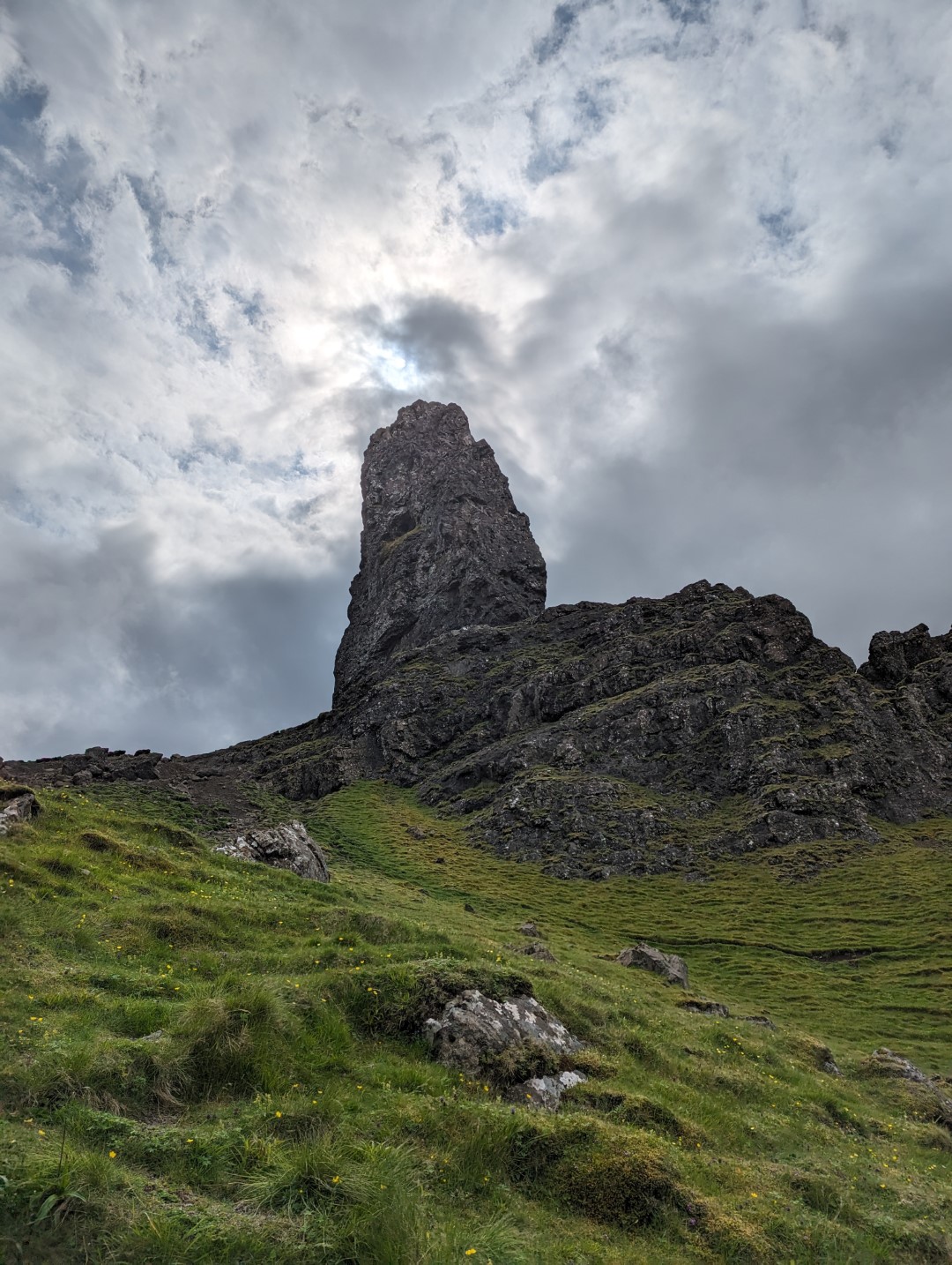 The Old Man of Storr with bright clouds behind
