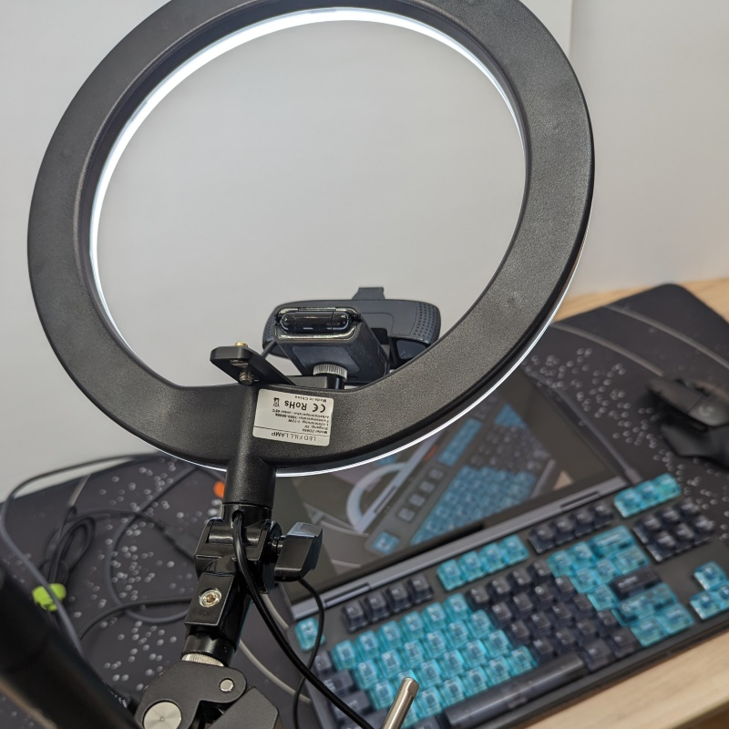 View from above of ring light and webcam pointed down at computer screen